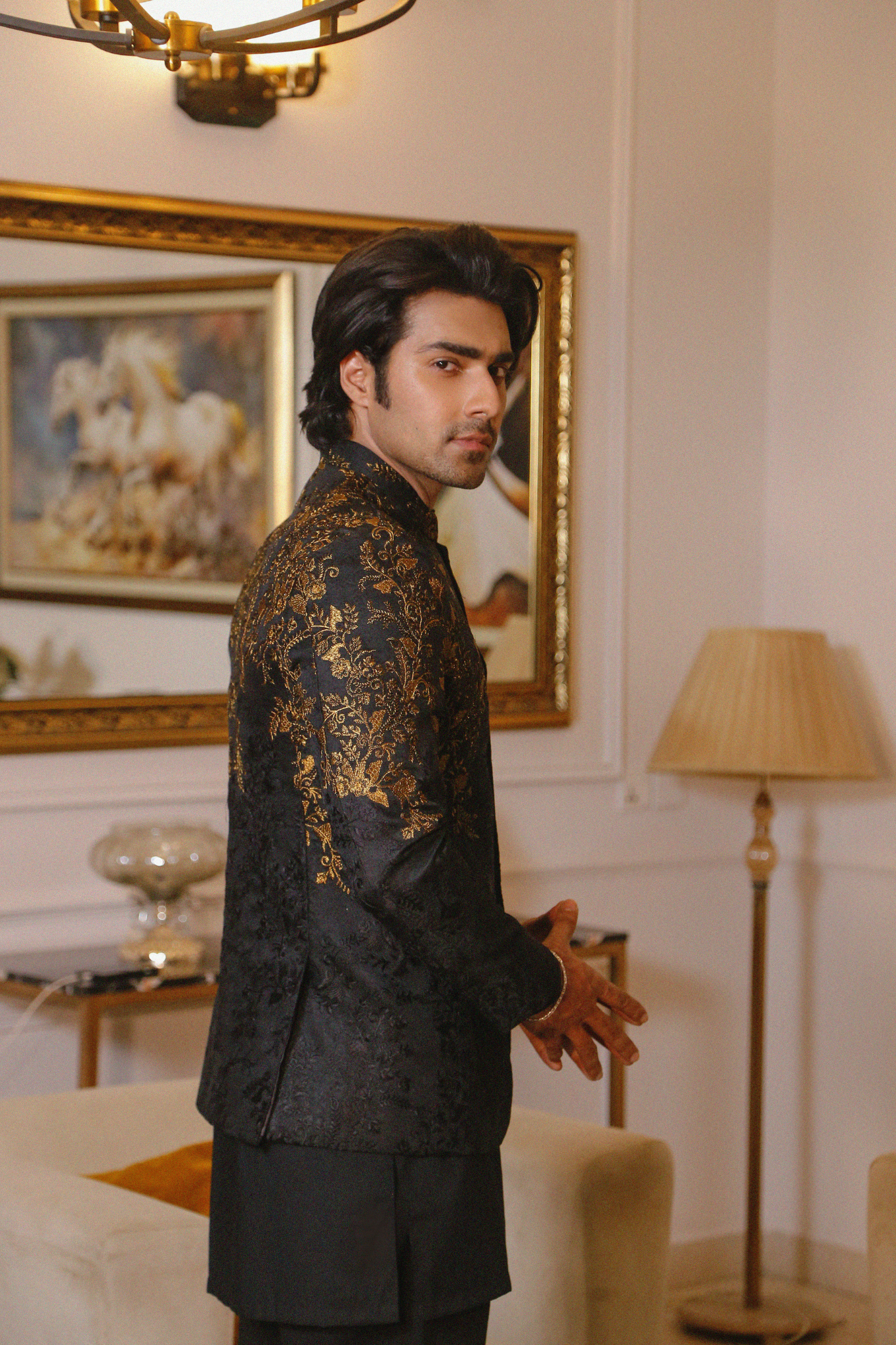 Elegant black prince coat featuring gold woven metallic embroidery