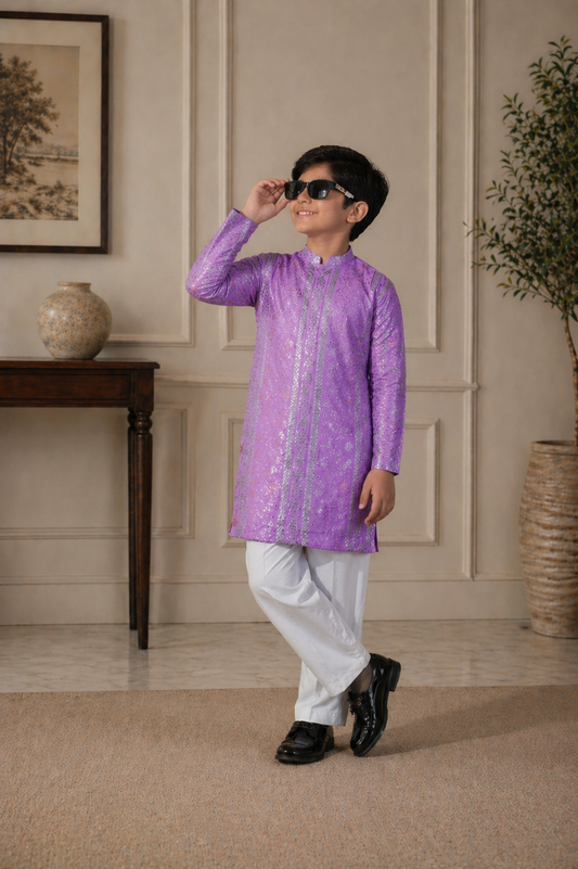 Child wearing a purple kurta with white pants