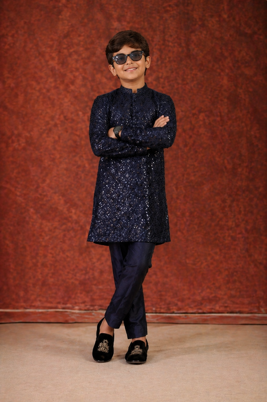 Son wearing a dark blue embroidered kurta