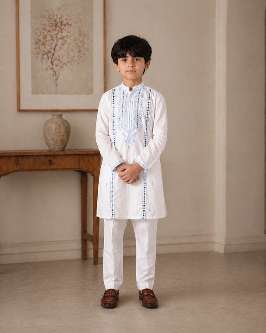 Young boy in a white traditional outfit