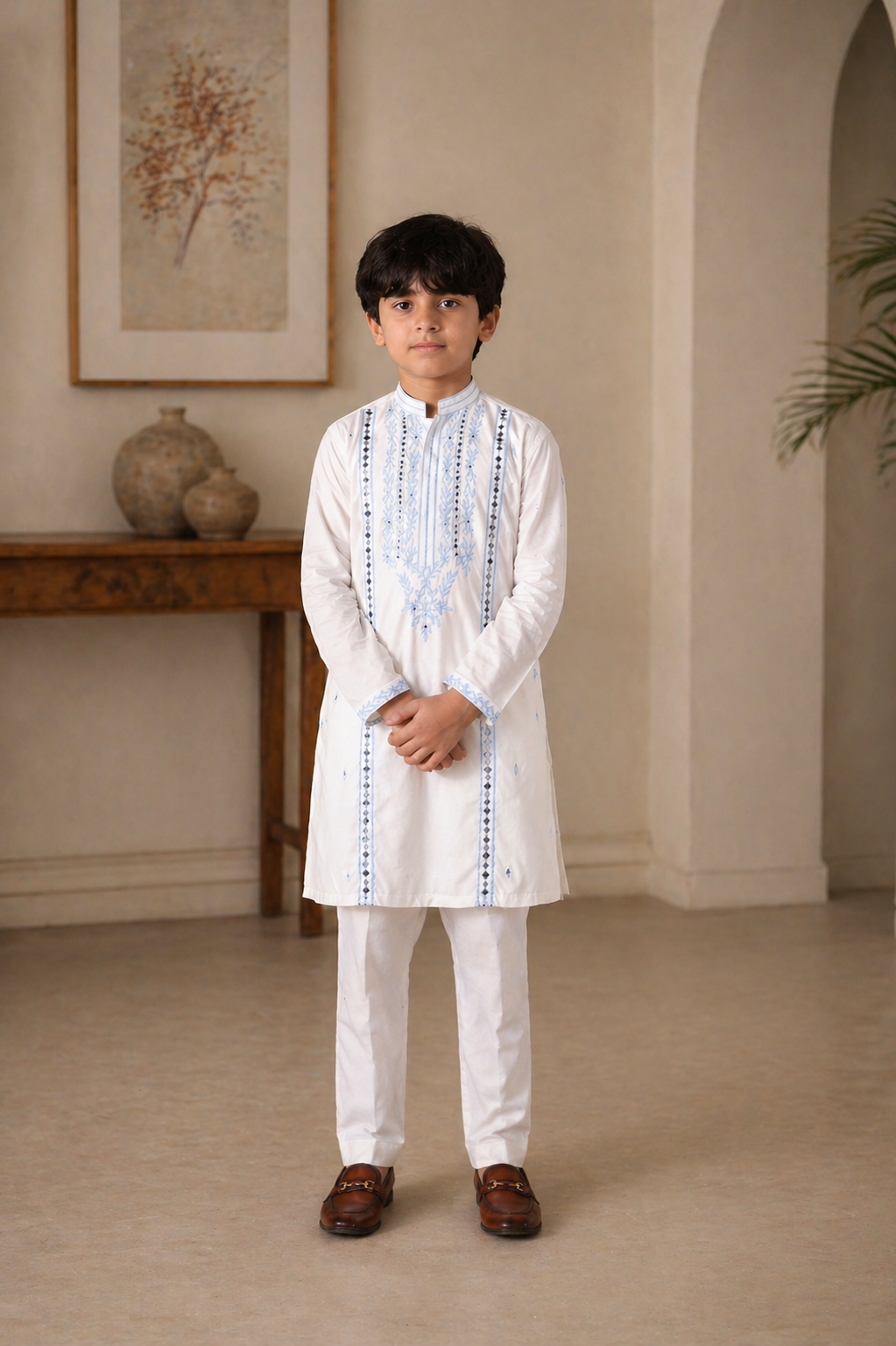 kid in a white traditional outfit