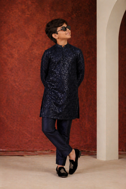 Child wearing a dark blue sequined outfit