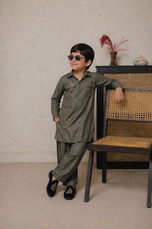 Child wearing a green outfit