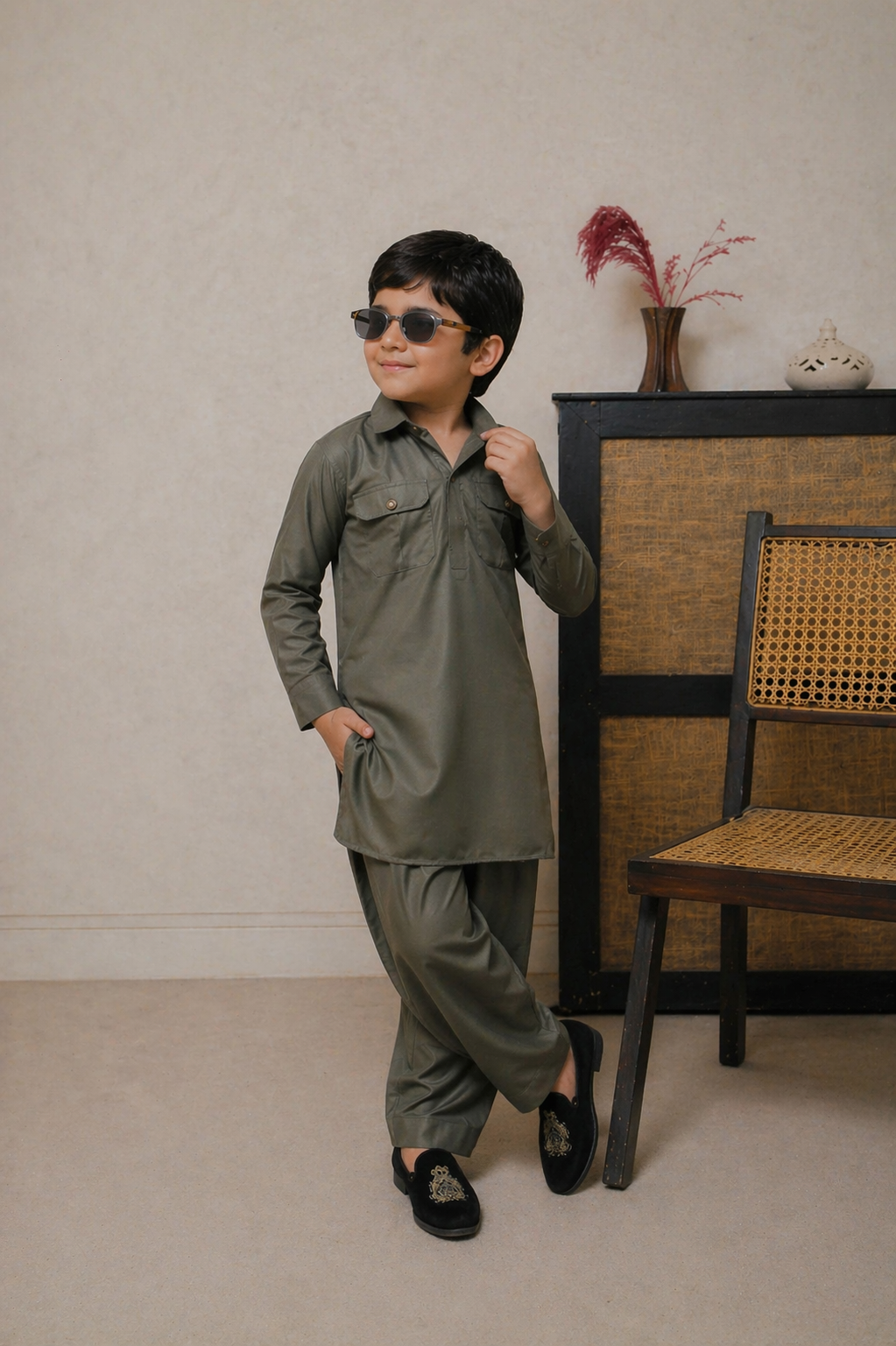 Child wearing a green outfit