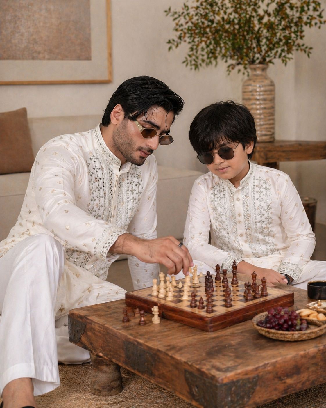 Man and child playing chess in a living room setting