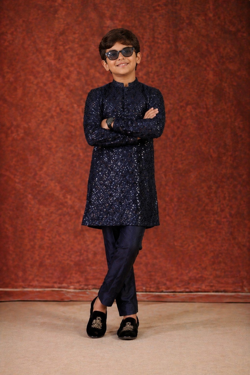 Son wearing a dark blue embroidered kurta